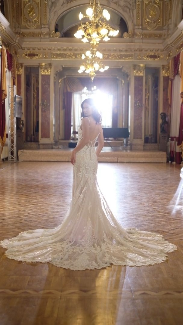 Val Stefani Bridal D8274 Ornate Beaded Lace V-Neck Mermaid Bridal Gown With Beaded Straps And Long Sparkle Petal-Shaped Train Val Stefani Bridal D8274 Ornate Beaded Lace V-Neck Mermaid Bridal Gown With Beaded Straps And Long Sparkle Petal-Shaped Train