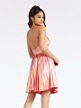 Thigh length coral party dress with flowy pleated skirt and open back with straps Thigh length coral party dress with flowy pleated skirt and open back with straps