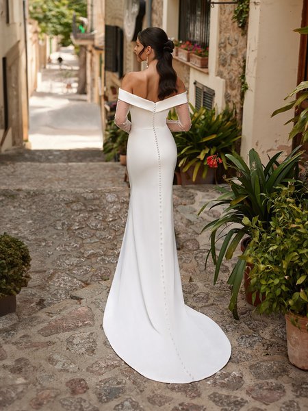Back view of bride wearing off the shoulder wedding dress with sweep train Back view of bride wearing off the shoulder wedding dress with sweep train